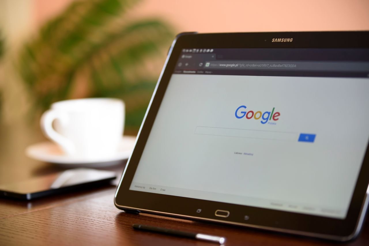 services-01 Samsung tablet on desk showing Google homepage, perfect for technology-related content.